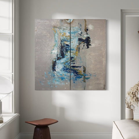 The BODY II” by Atelier Marx displayed in a light-filled modern interior — a dual-panel abstract painting with blue, gold, and black textures evoking physical presence and movement.
