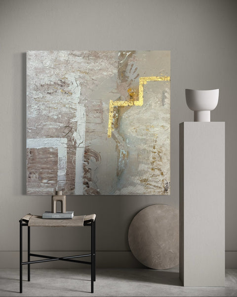 “The BODY I” by Atelier Marx displayed in a contemporary interior with minimalist decor — a textured abstract painting with hand impressions, white geometric forms, and bold gold leaf accents.